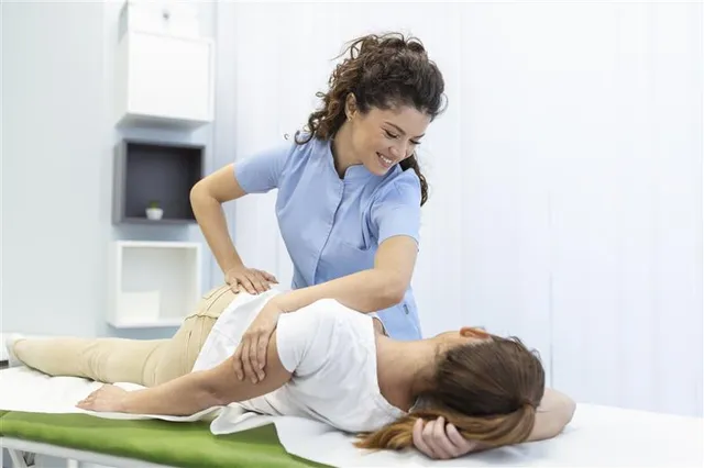 Chiropractor treating patient for work injury
